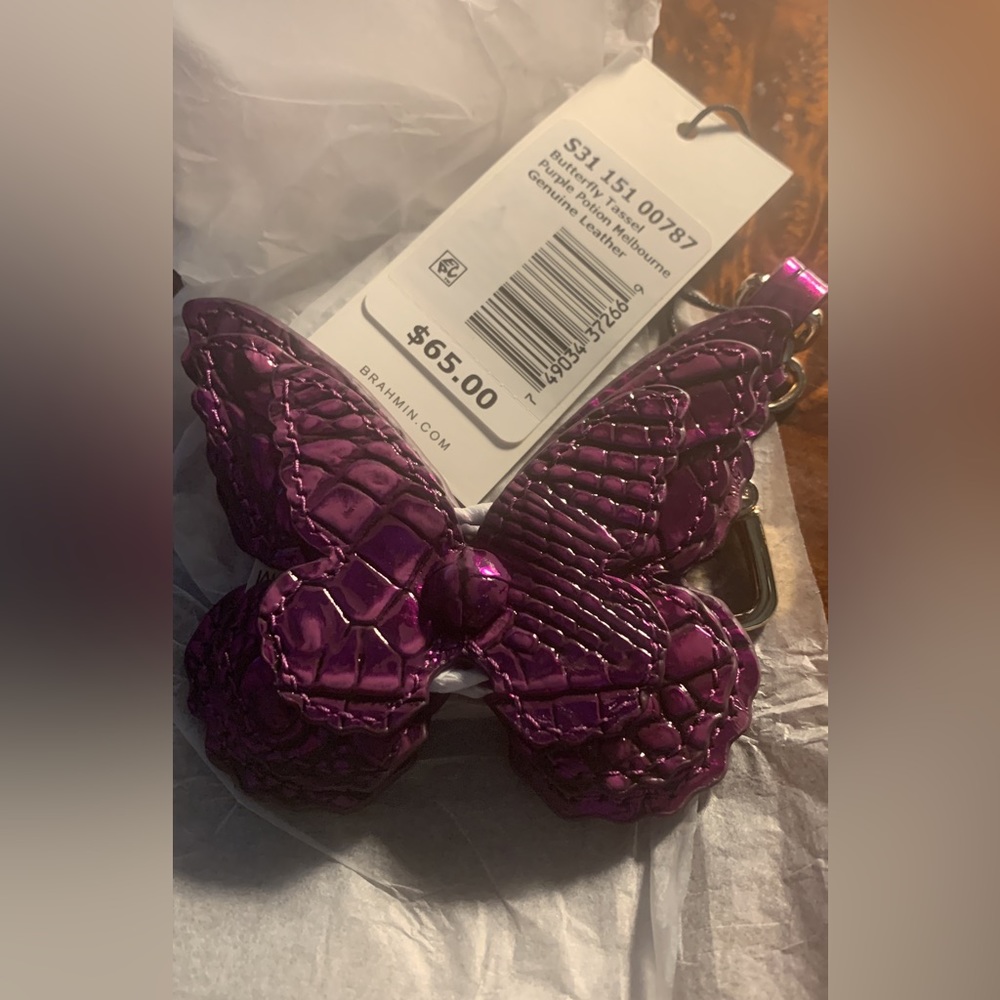 NWT purple potion butterfly tassel